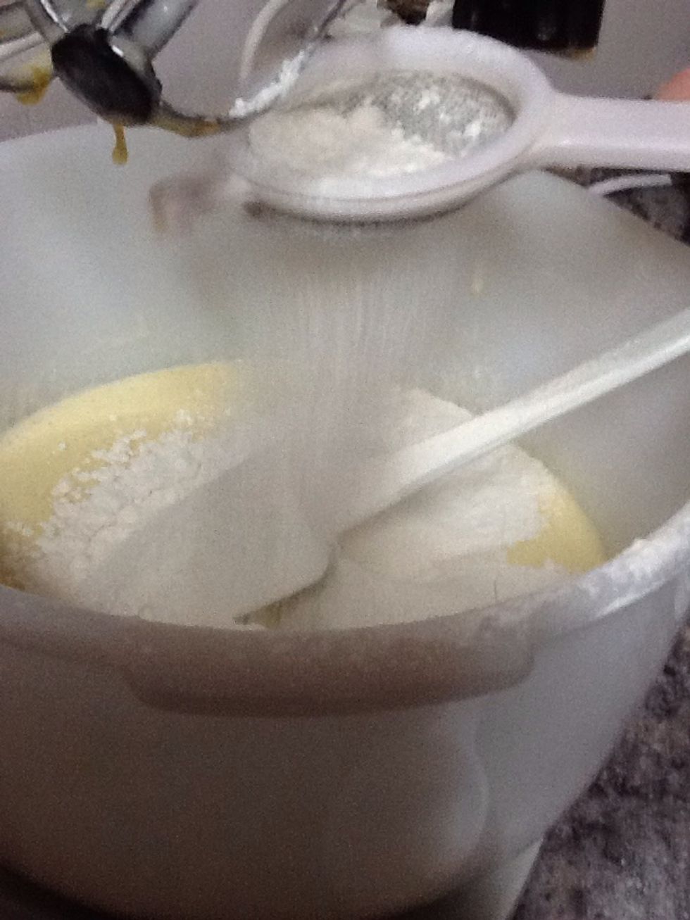 Once you've done that you have to sift 1 1/3 cups of flour. Make sure that you stir it with the electric mixer.