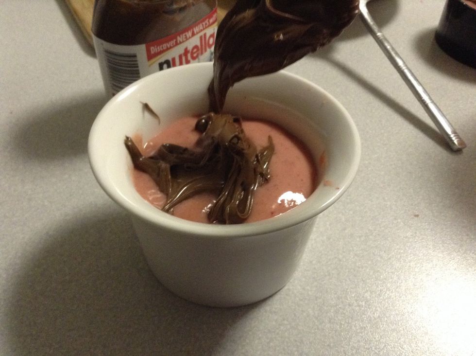 Once you've drizzled some nutella on your sorbet you may want to add a piece of strawberry ontop to enjoy.