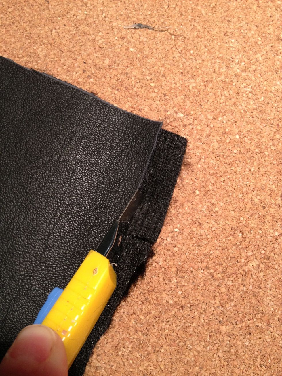 Once you've finished gluing the fabric to the leather, use a sharp knife and cut the excess fabric that may stick out. Giving the leather a nice, clean look.