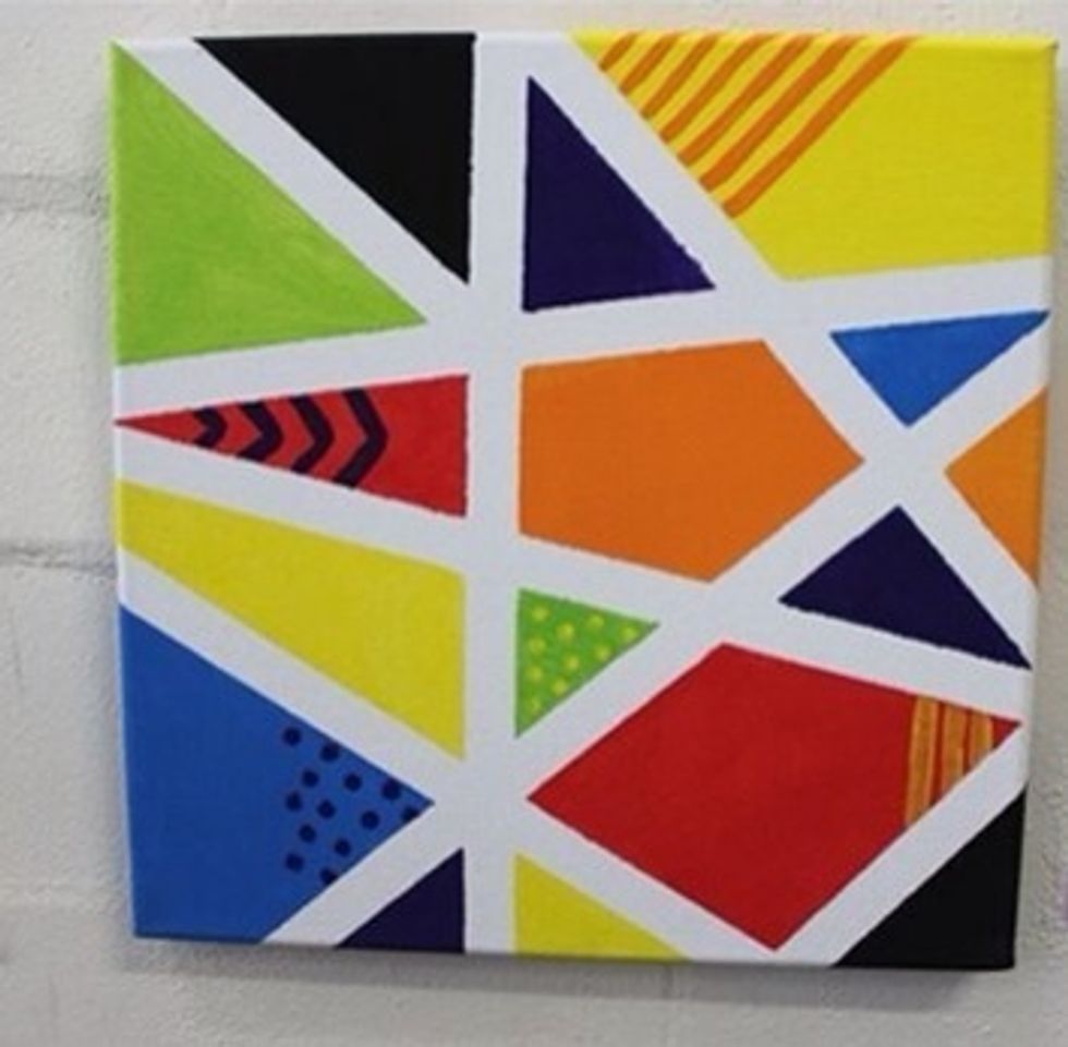 Once you've finished taking off the tape it's your choice if you'd like to add dots, chevrons, or stripes. Display this wonderful piece around your house!