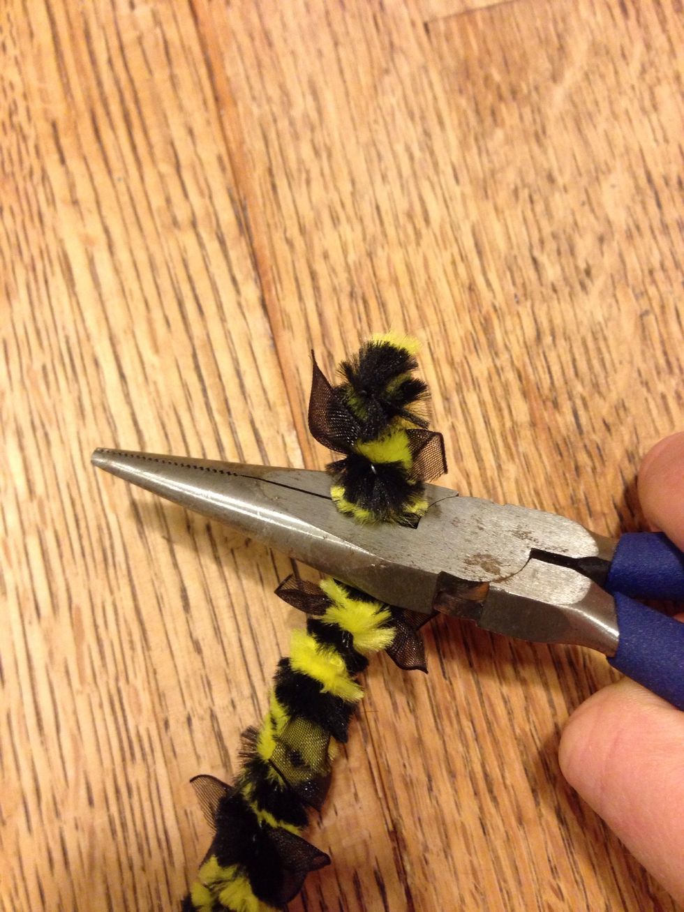 Once you've finished the row, snip between each of the sets of wings with a pair of pliers or strong scissors.