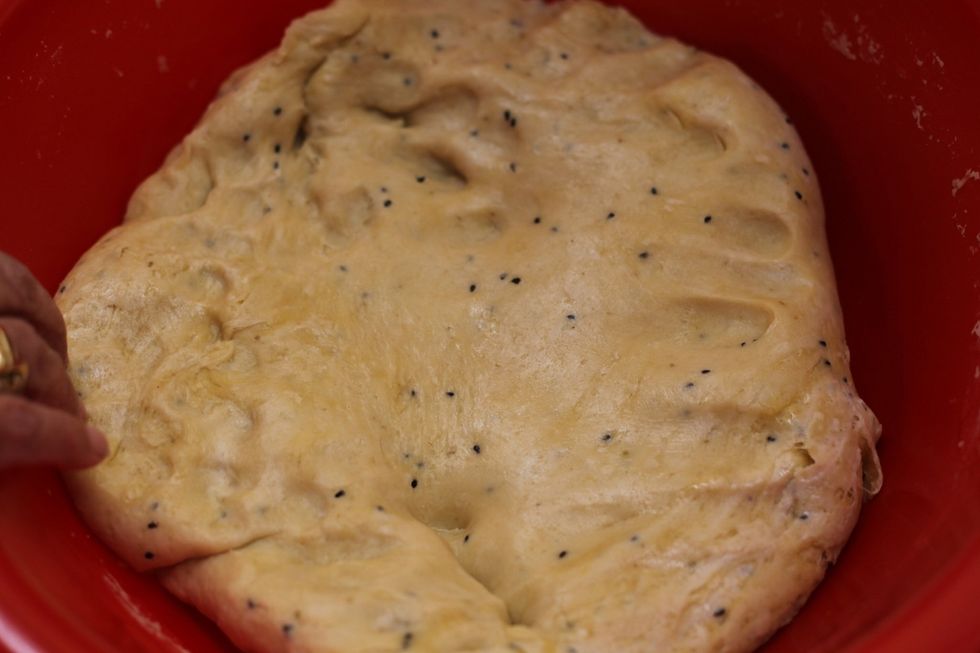 Once you've mixed it thoroughly, you will find the texture of the dough is almost elastic. A nice shiny glow on your dough with little black sesame seeds floating through it.