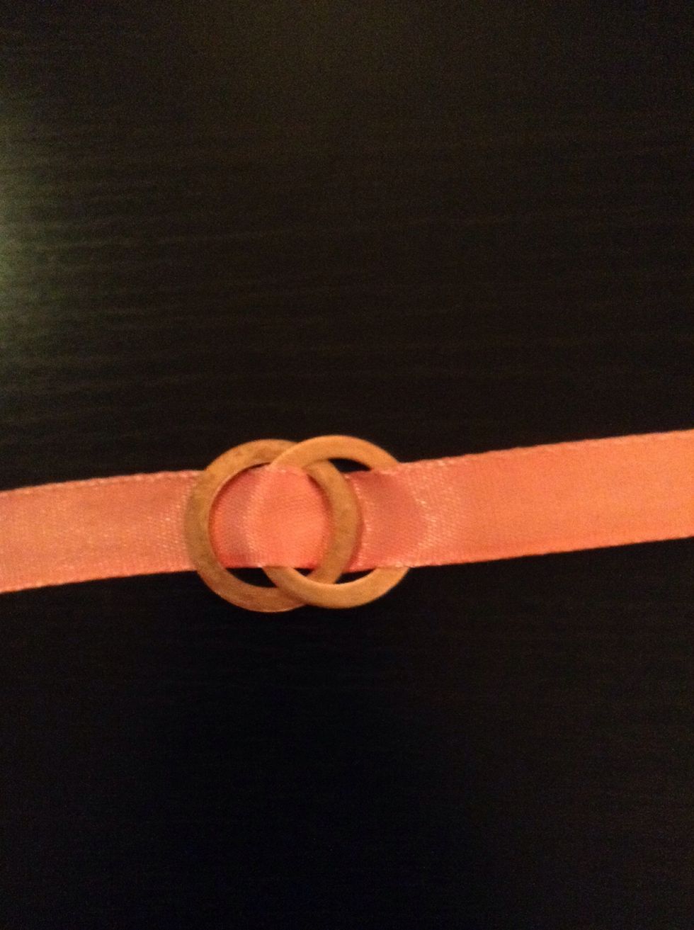 Once you've pulled the ribbon through, you will have something like this. Continue doing this by following the pattern in the first step.