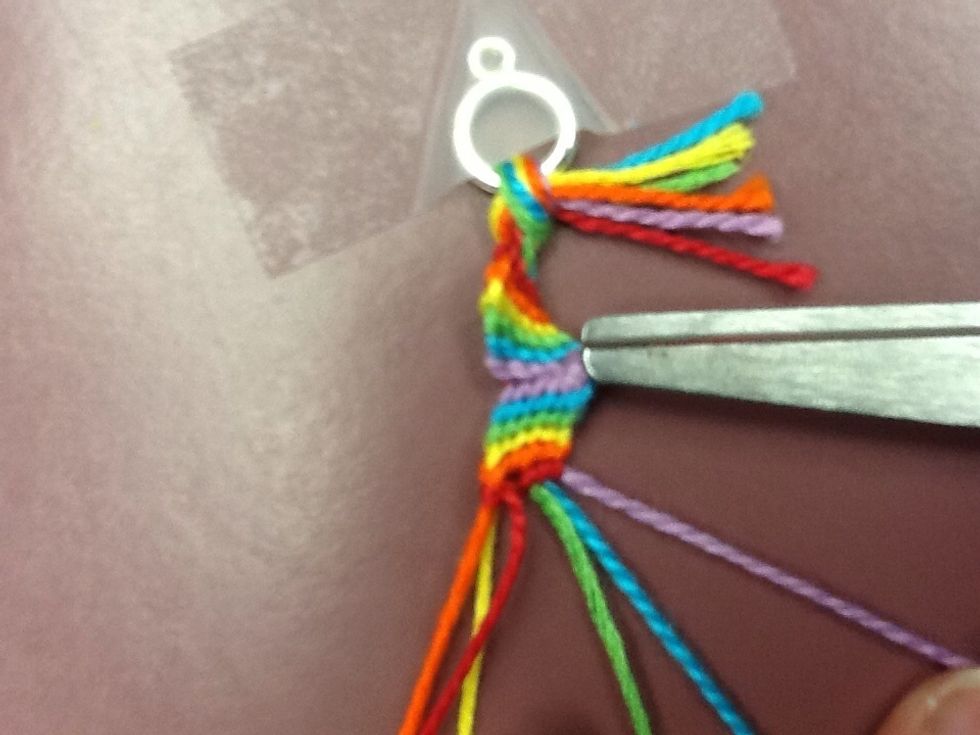 Once you've reached the last string (red), change directions and go left to right once again. So the last string (red) becomes the first string.