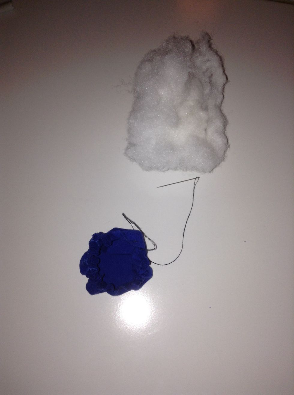 Once you've stitched your way through the entire circle you will end up with a pouch like so. Get some stuffing from an old pillow and fill the pouch in to your preferred size.