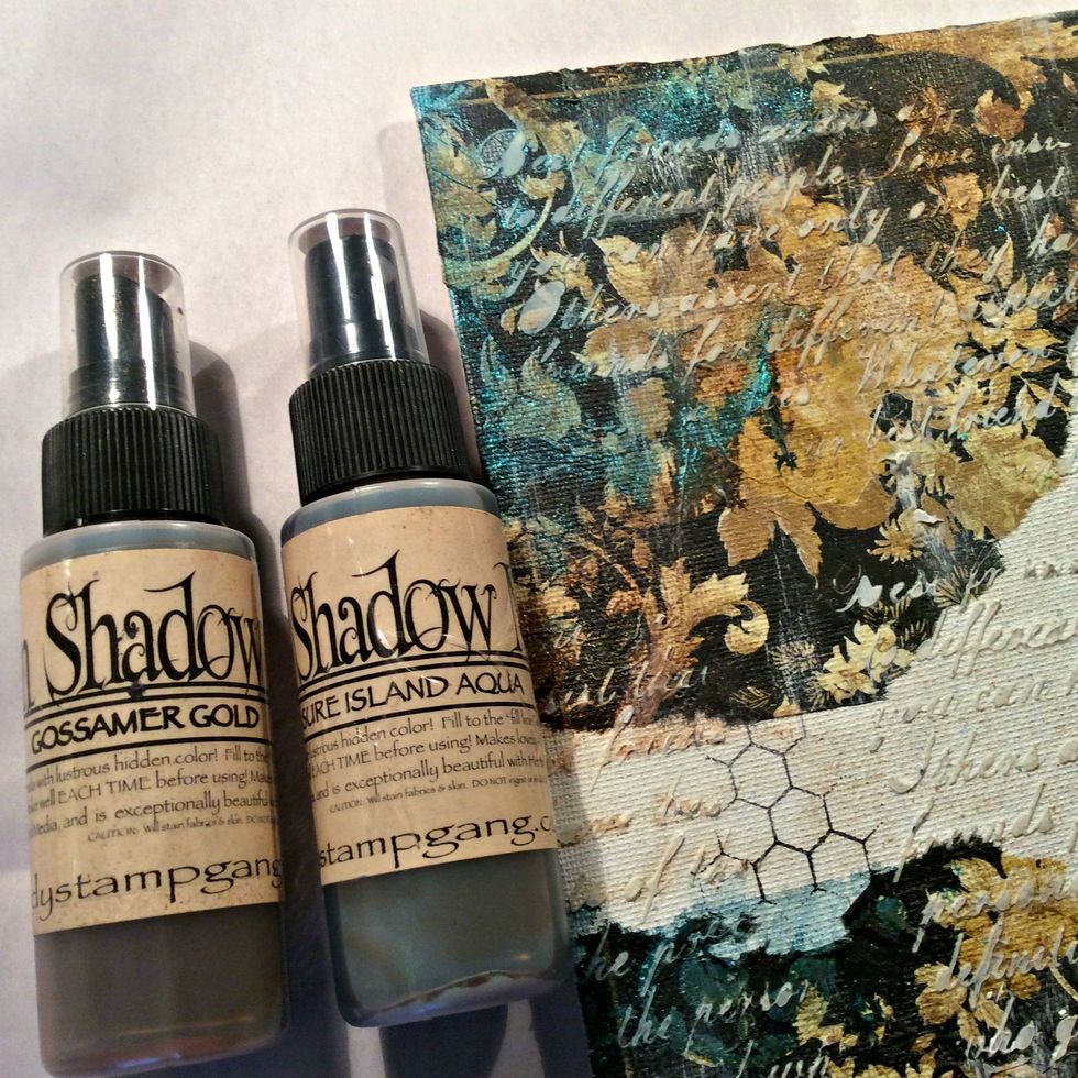 Once your background has dried start spraying your mists. I chose Treasure Island Aqua and Gossomer Gold Moon Shadows. Moon Shadows are beautiful to use to give that vintage look.