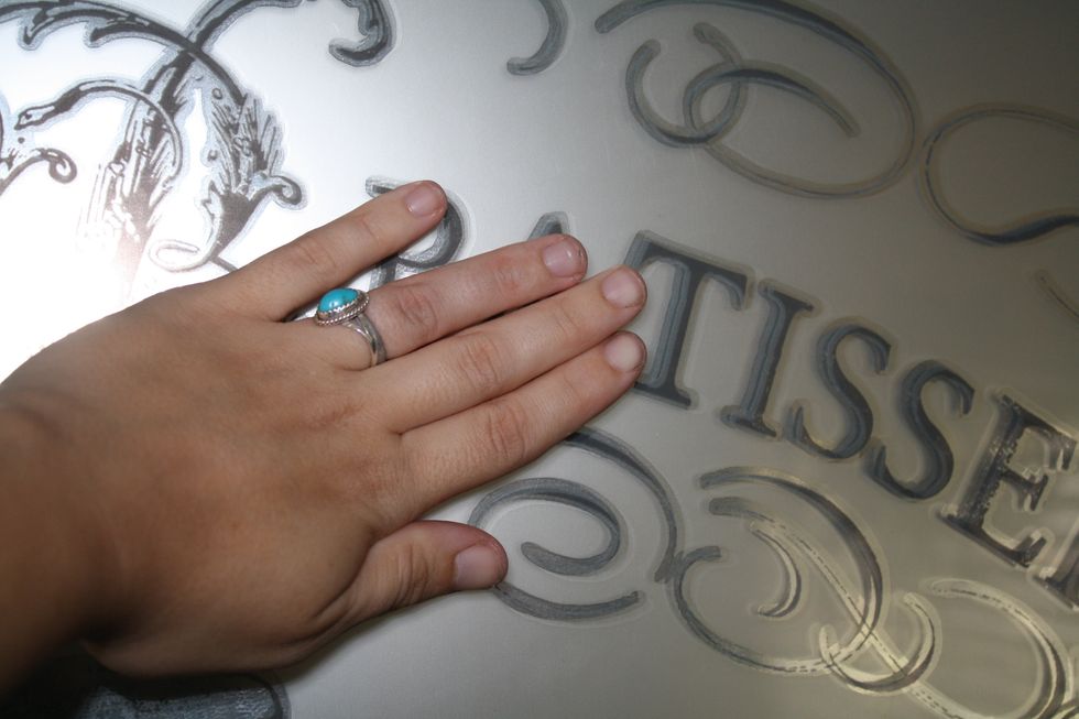 Once your backing is off, and you have your piece centered, you are ready to rock! It is SO EASY! All you do is rub with your hands to start the process! I gently rubbed all across ALL of the areas.