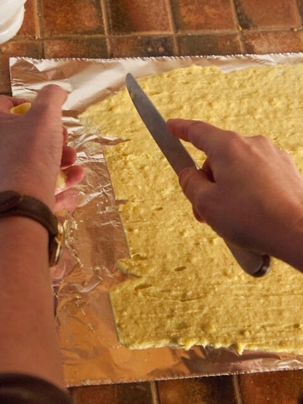 Once your batter has dried, take a knife and trim off the ragged tops and sides. This will make them even and easier to cut and roll.