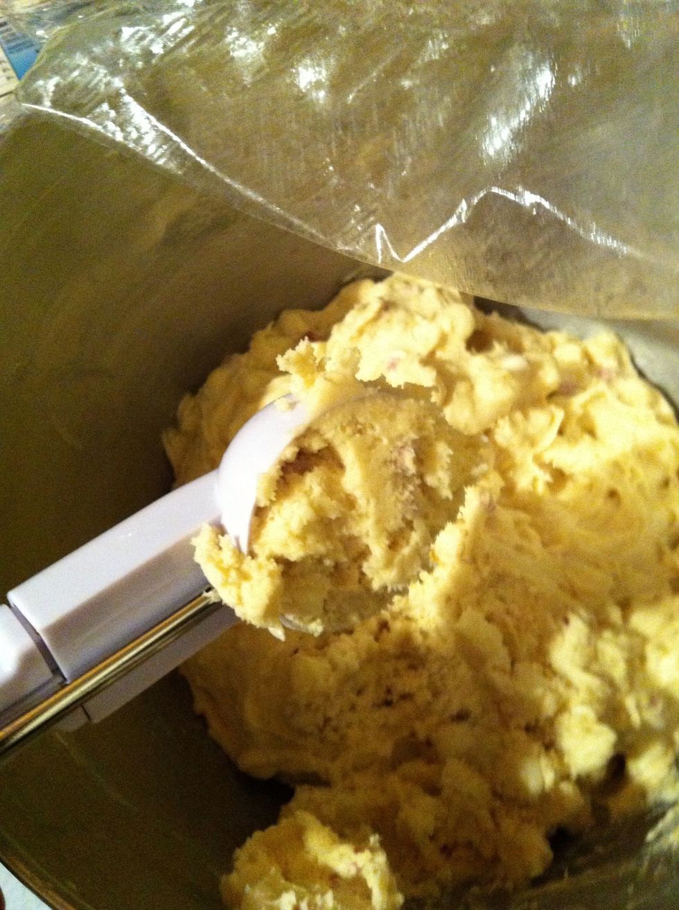 Once your batter has stiffened from being refrigerated, using a cookie scoop, scoop the batter on to your parchment lined cookie sheet.