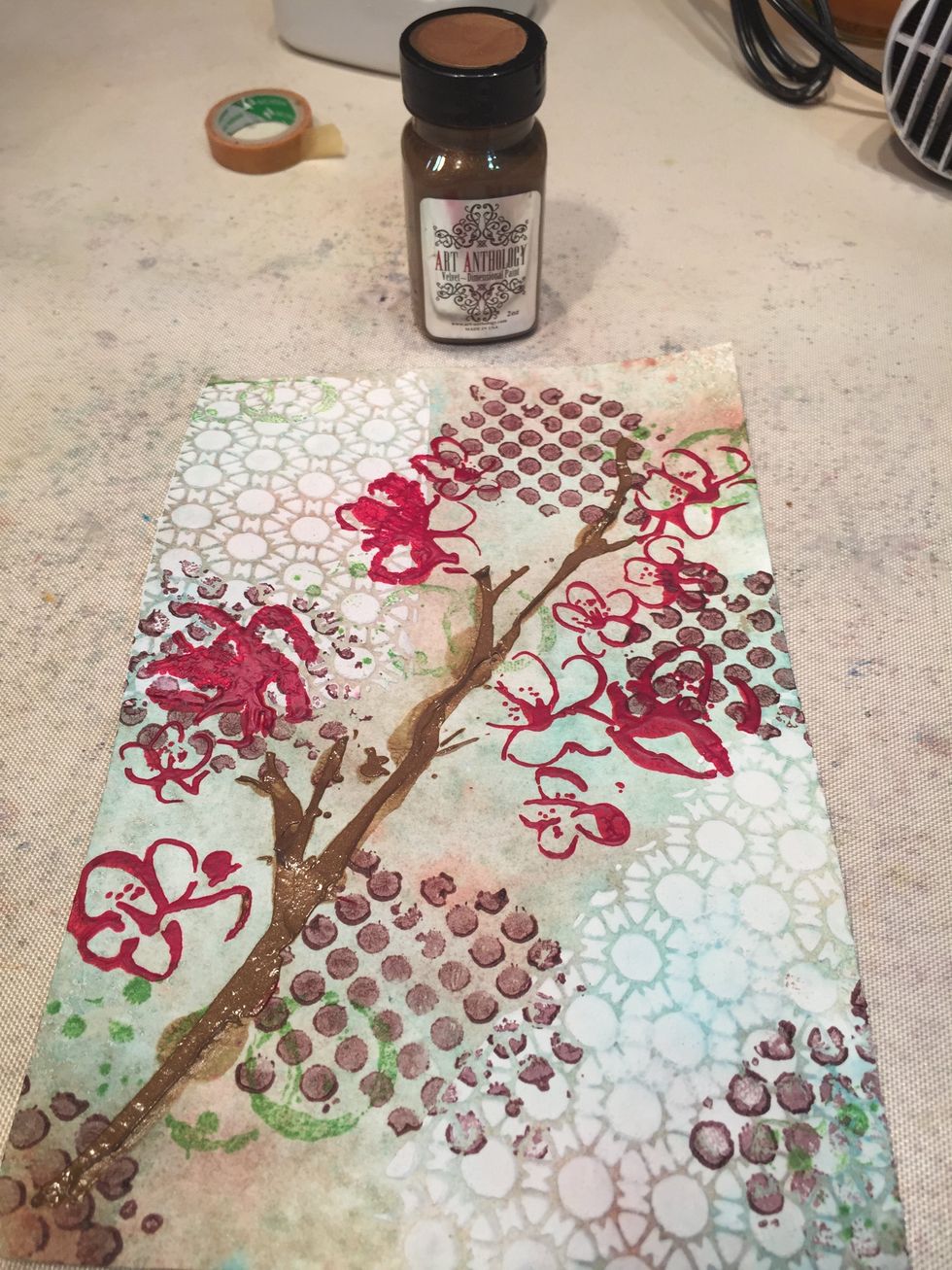Once your blossoms are dry, position the Blossom stencil back over them, masking off the blossoms and stenciling the branches with Kona Velvet. I didn't worry about clean lines as I wanted thickness.