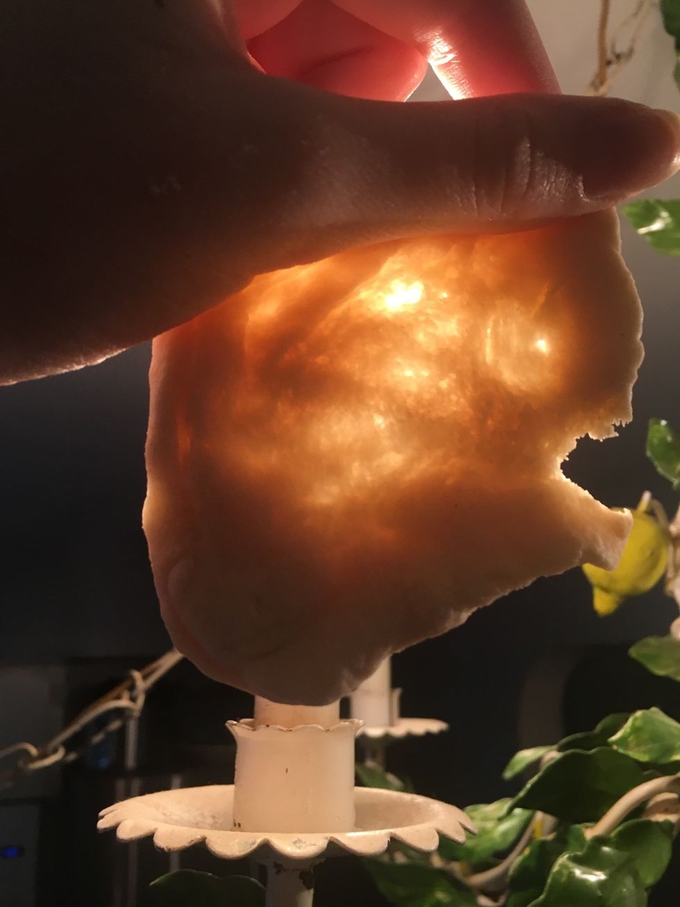 Once your dough has a smooth surface, take a small piece and stretch it while holding it up to a light- if it tears before you can see the light, keep kneading