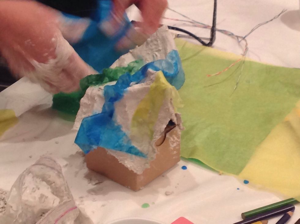 Once your fabric is draped the way you want it add color with tissue paper, paints and colors.