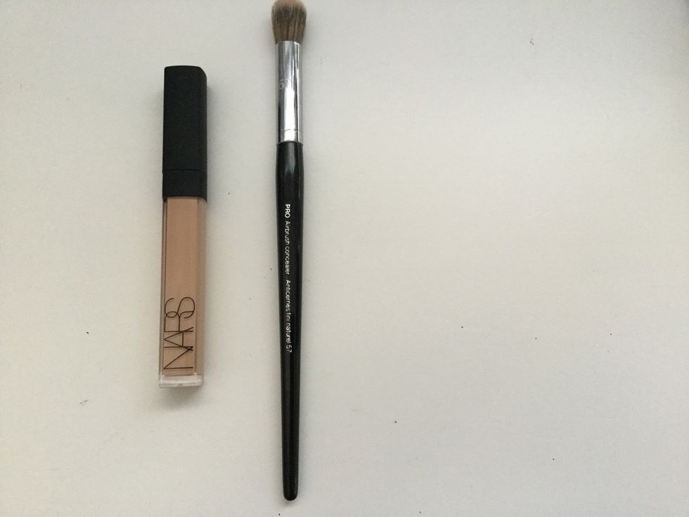 Once your face is make up free get out your concealer and concealer brush and apply concealer under eyes, on nose, above forehead, on cheek bones and on chin. Then blend in a back and fourth motion.