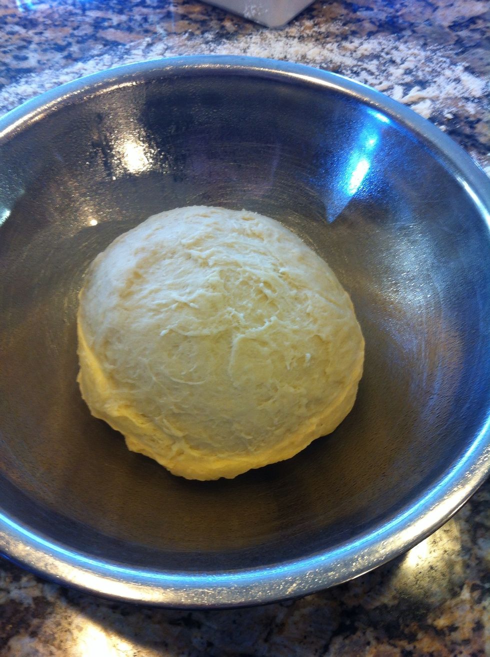 Once your finished kneading, place in a large, lightly oiled bowl to rise. Cover with plastic wrap and place somewhere warm (I use my laundry room) and let proof for about an hour.