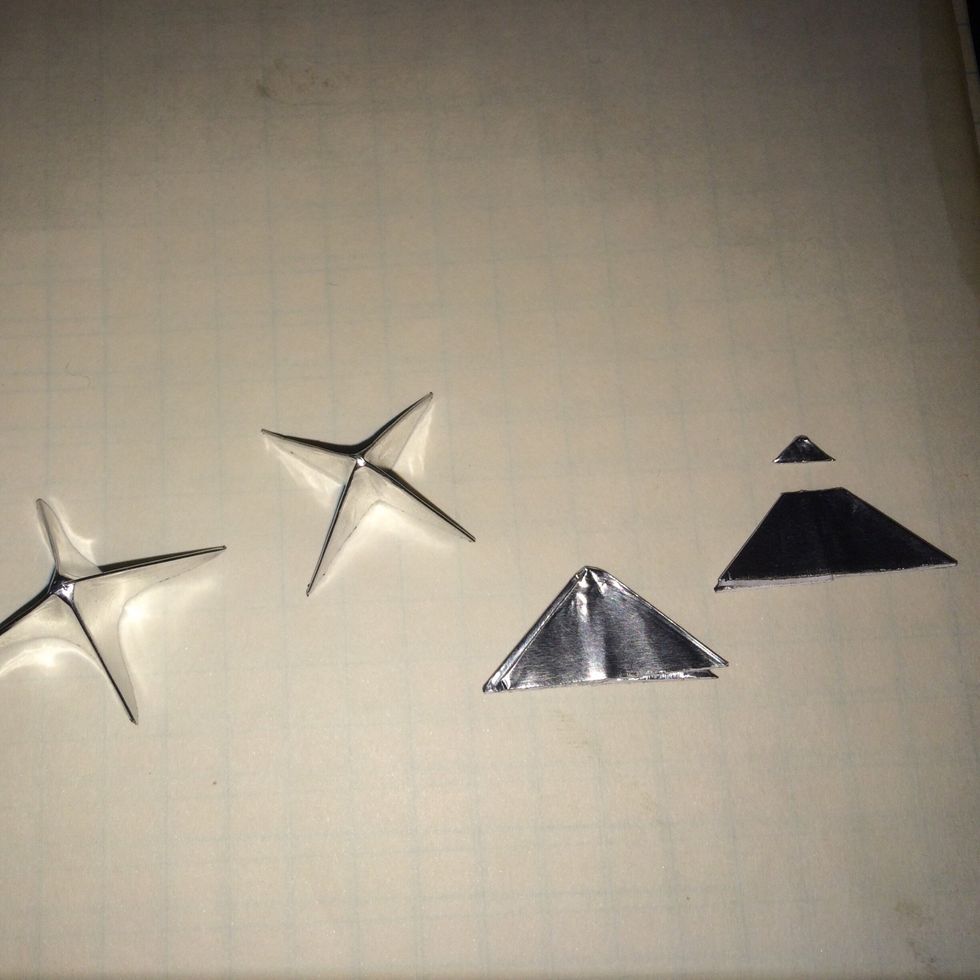 Once your have formed the wings fold them in half and cut off the top about 1/8" - 3/16" down. Once all squares are done put them aside for now.