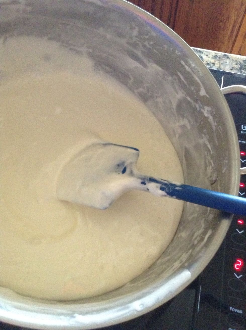 Once your marshmallows are smooth and melted, remove from heat and add the rice cereal