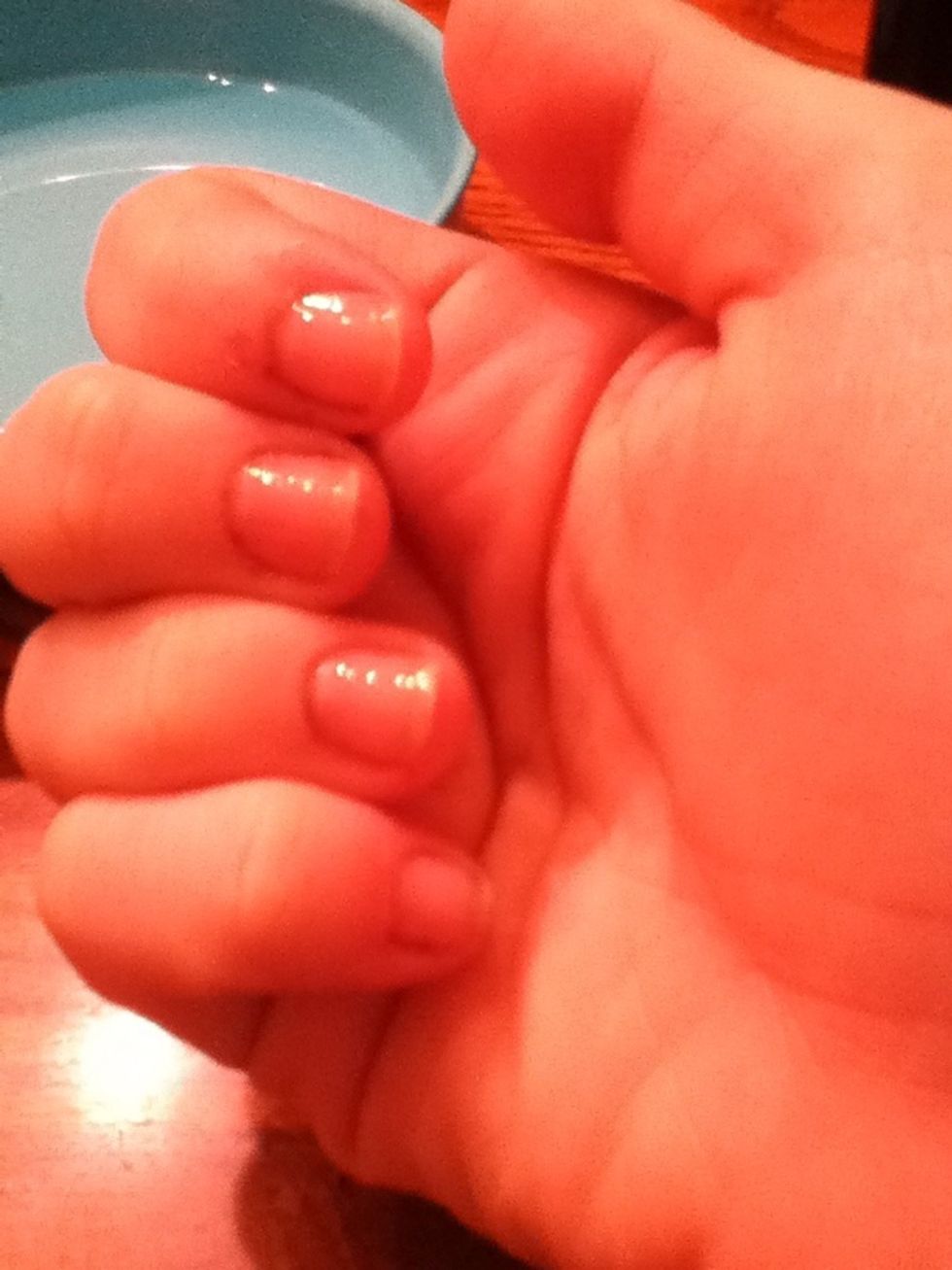 Once your nails are dry, put on a clear coat of nail polish to protect your nails.