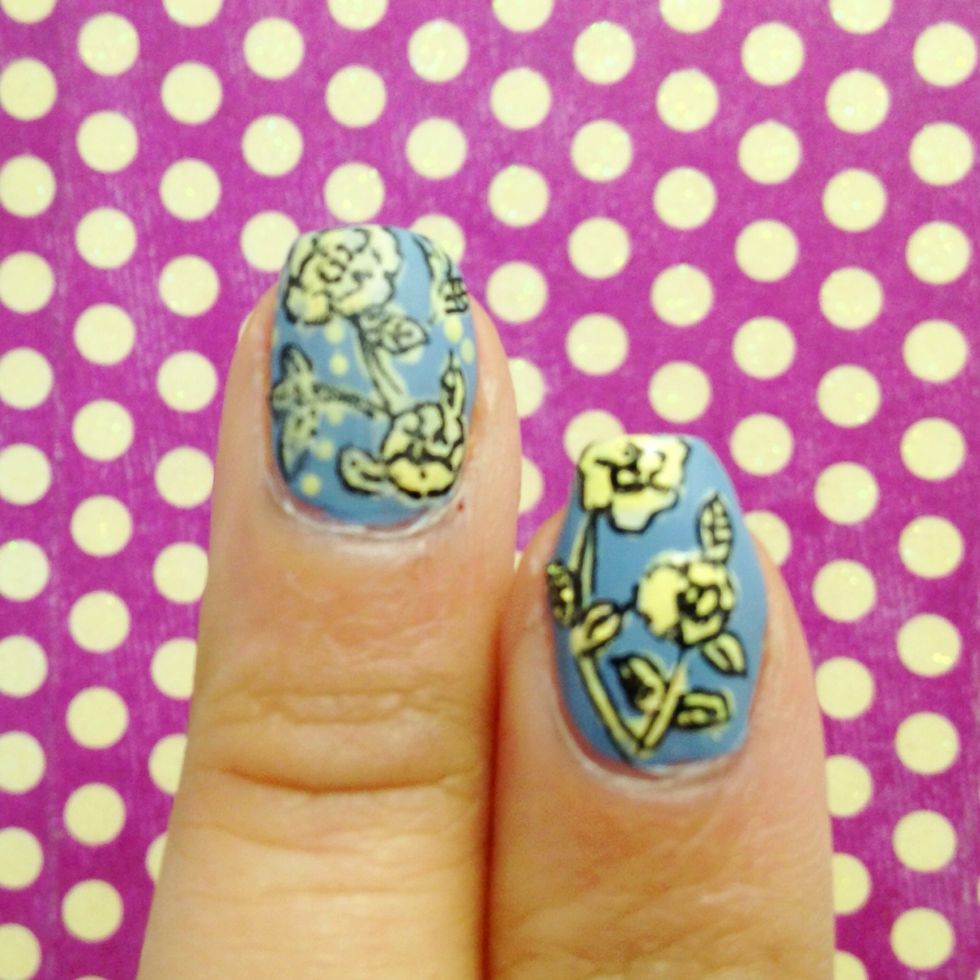 Once your nails have dried completely.  Use a black gel pen and create the fine details of the flowers.