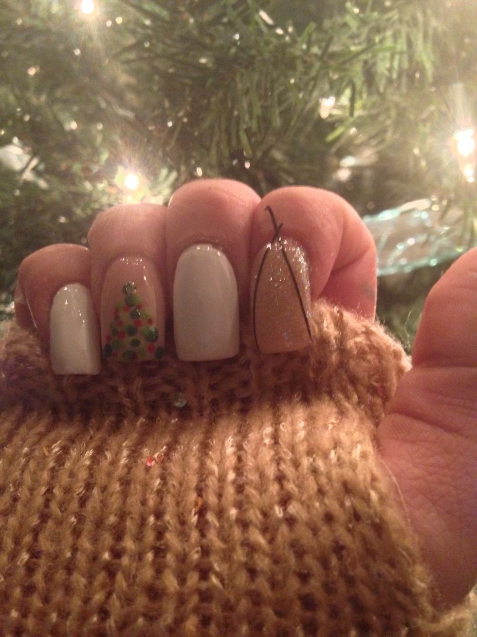 Once your polish is dry take some striping tape and create a V as shown.