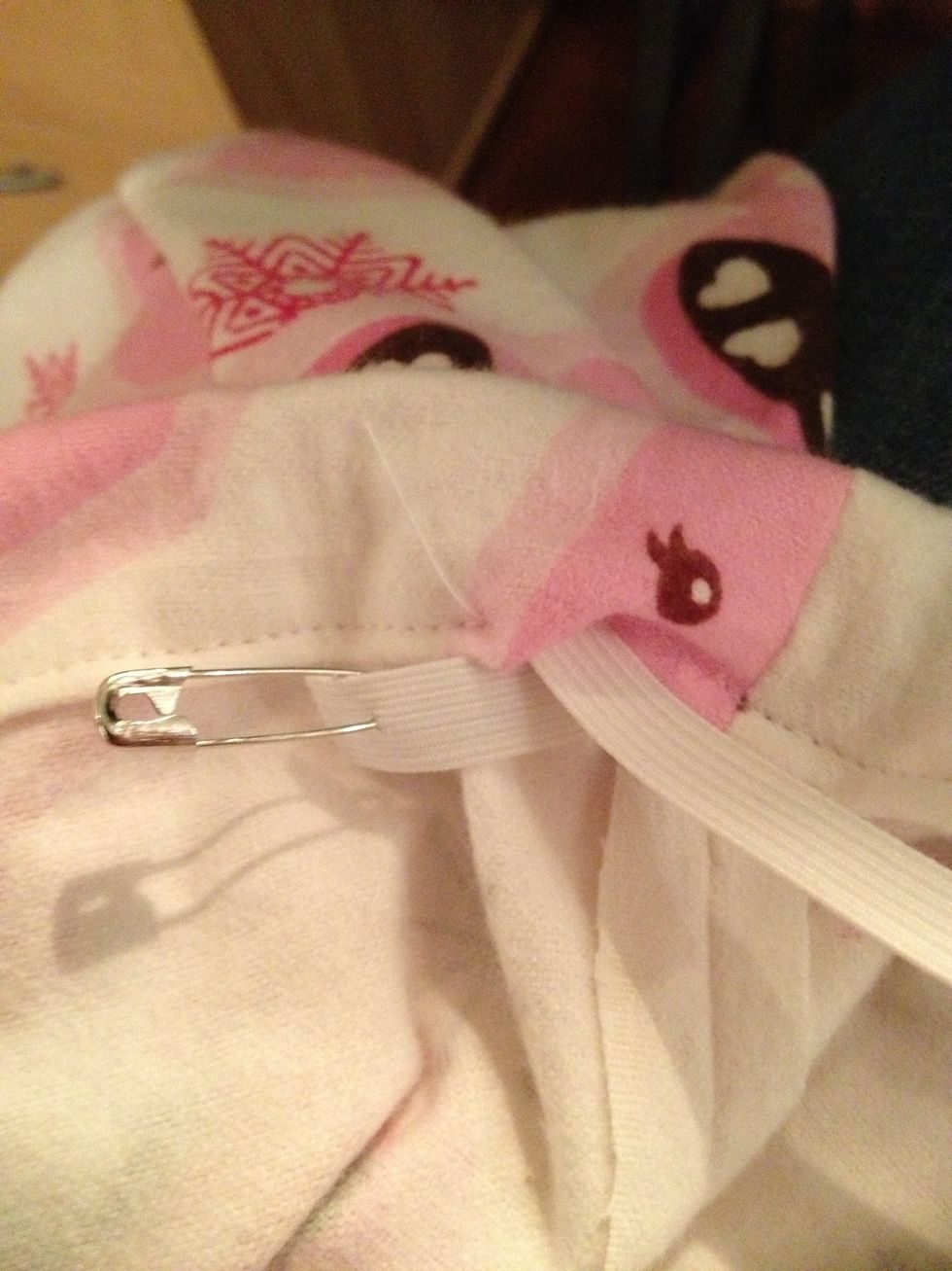 Once your safety pin makes it out the other side, you can remove it from the elastic and sew the two ends of elastic together tightly.