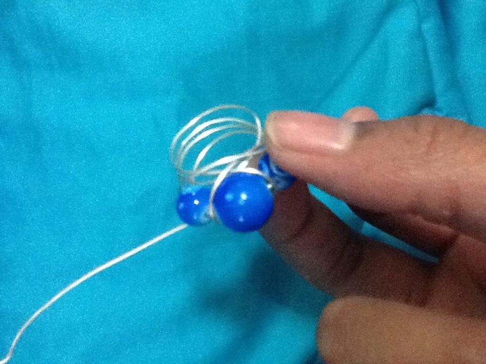 Once your satisfied with how many times you've wrapped the wire and have leftover wire then you can slide the ring of the mandrel