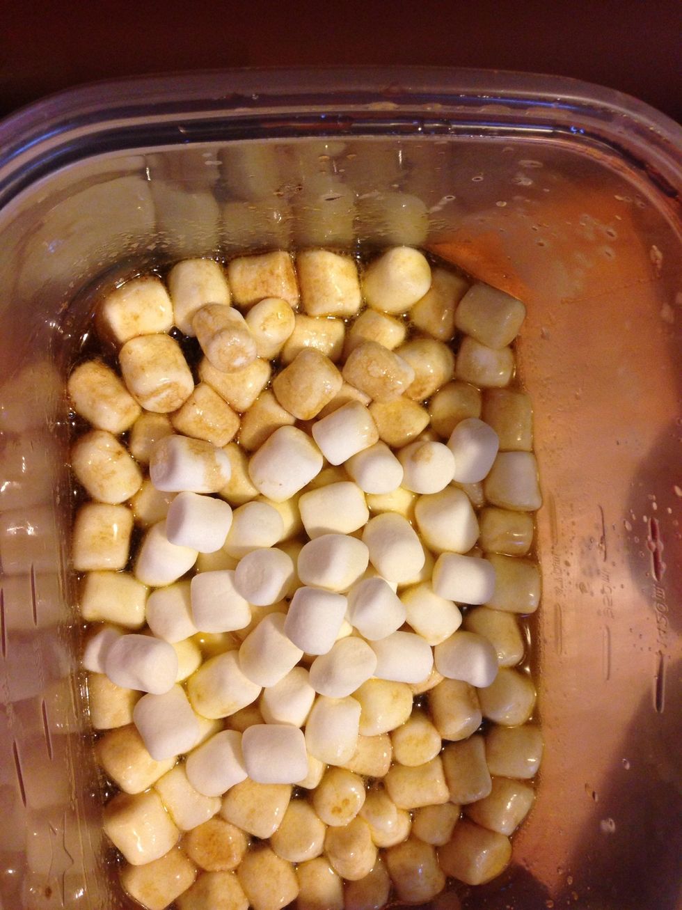 Once your sugar and butter have melted together stir in the marshmallows and back in the microwave for another 2 minutes.