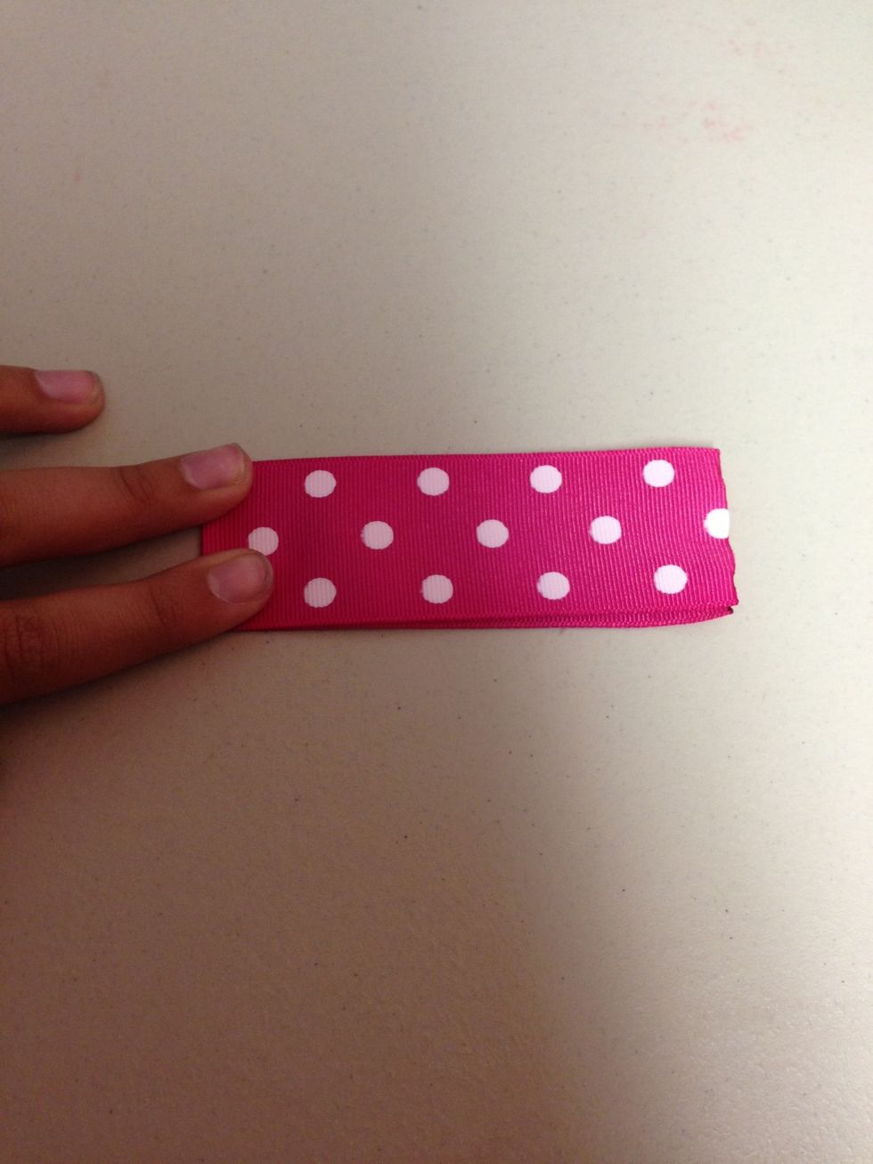 One at a time fold in half and make a crease.