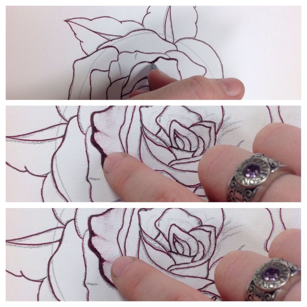 One at a time go over each petal with an ink pen while using your finger or tissue (just covers your finger) to pull the ink towards the core, creating shading.