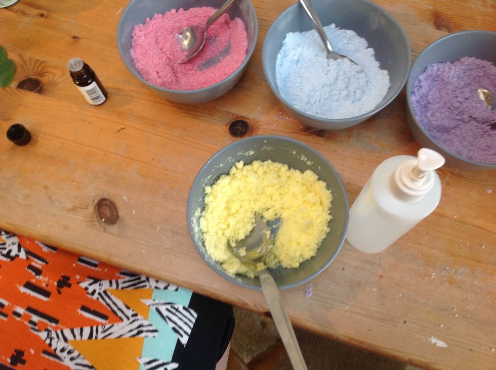 One at a time put 2 1/2 ml of each essential oil into two of your 4 colours and stir in, then spray at first 2 sprays of water into one of the mixes and stir quickly to avoid it fizzing