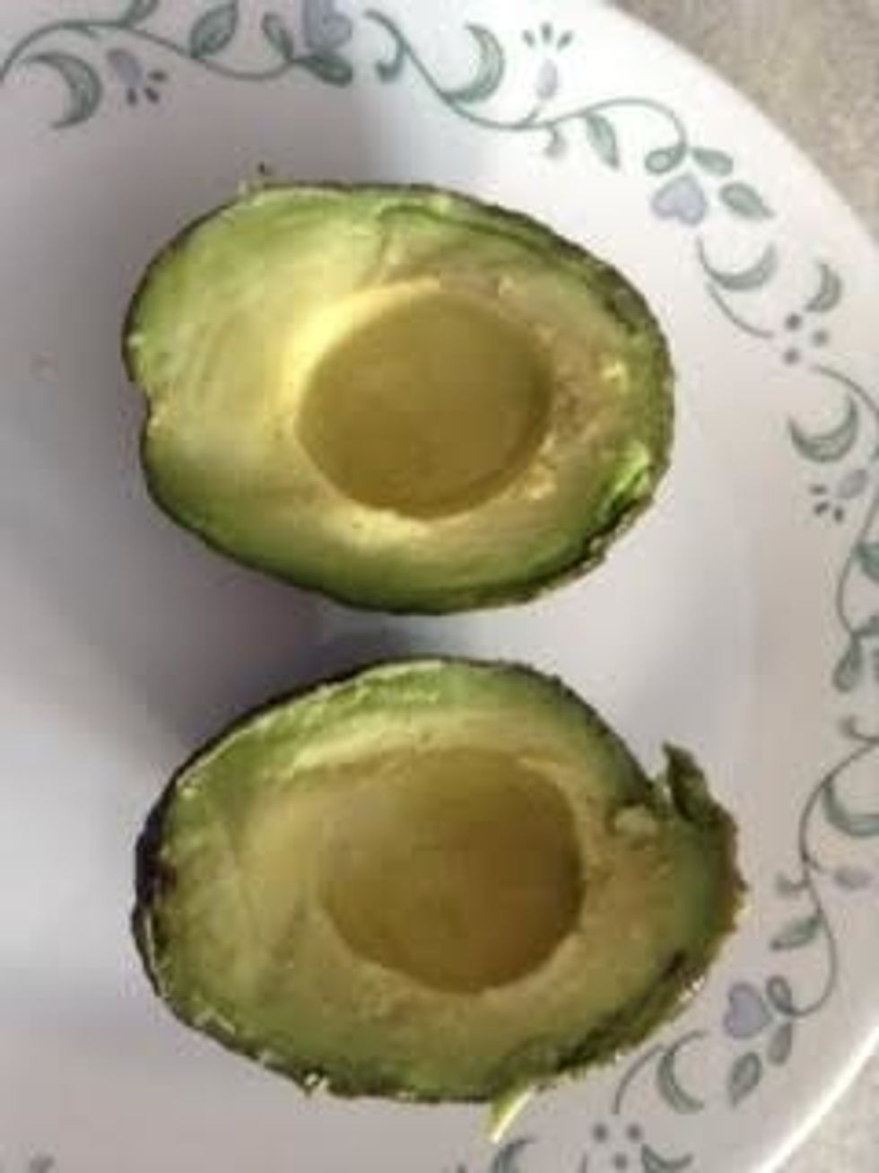 One Avocado cut in two pieces.