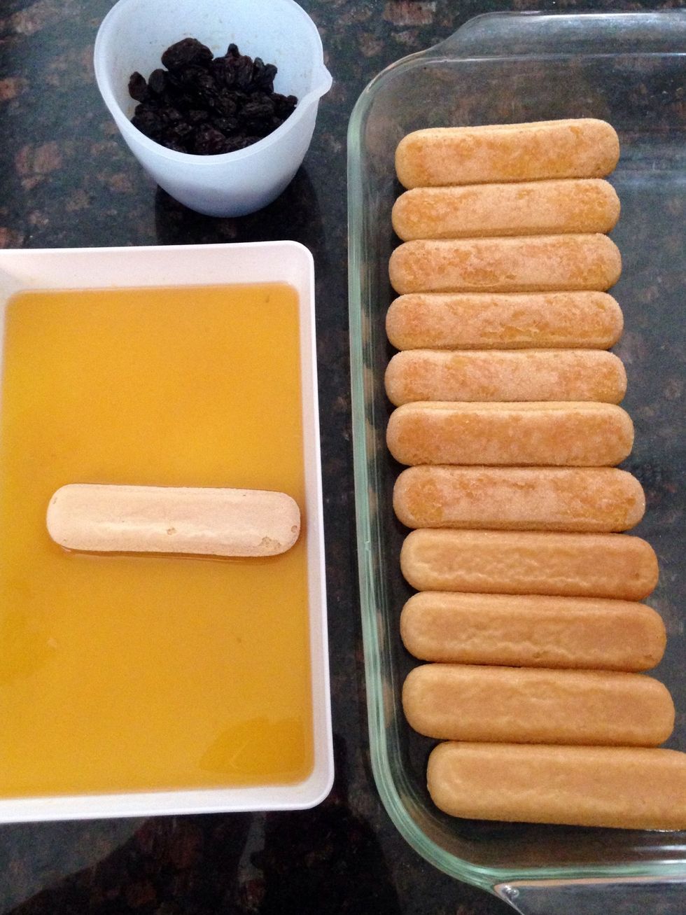 One by one you will dip a lady finger and then place into a 9x13 baking dish.