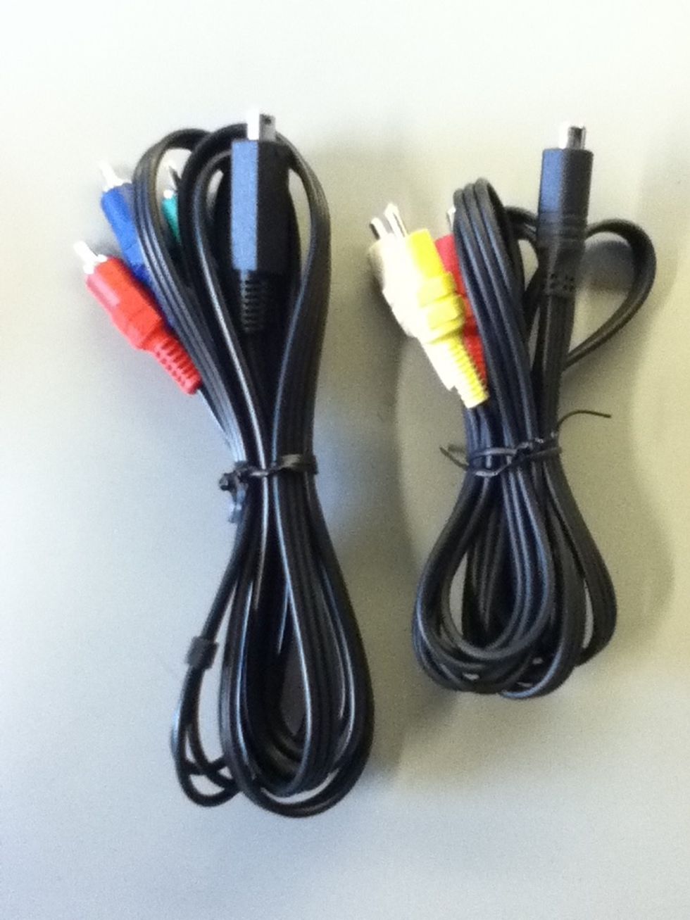 One cable has red, green, and blue ends. The other cable is red, yellow, and white on one side with a half moon shape on the other.