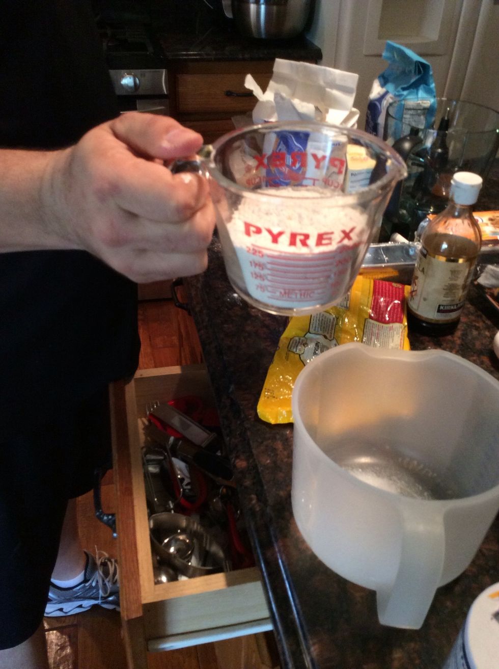 One cup of flour. Then add another cup of flour them another 1/4 cup.