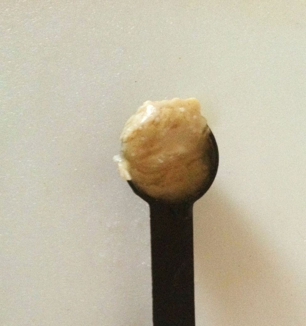 One heaping teaspoon of tahini (sesame paste). OR one tablespoon of tahini and two tablespoons of vegetable oil can be used as a substitute.
