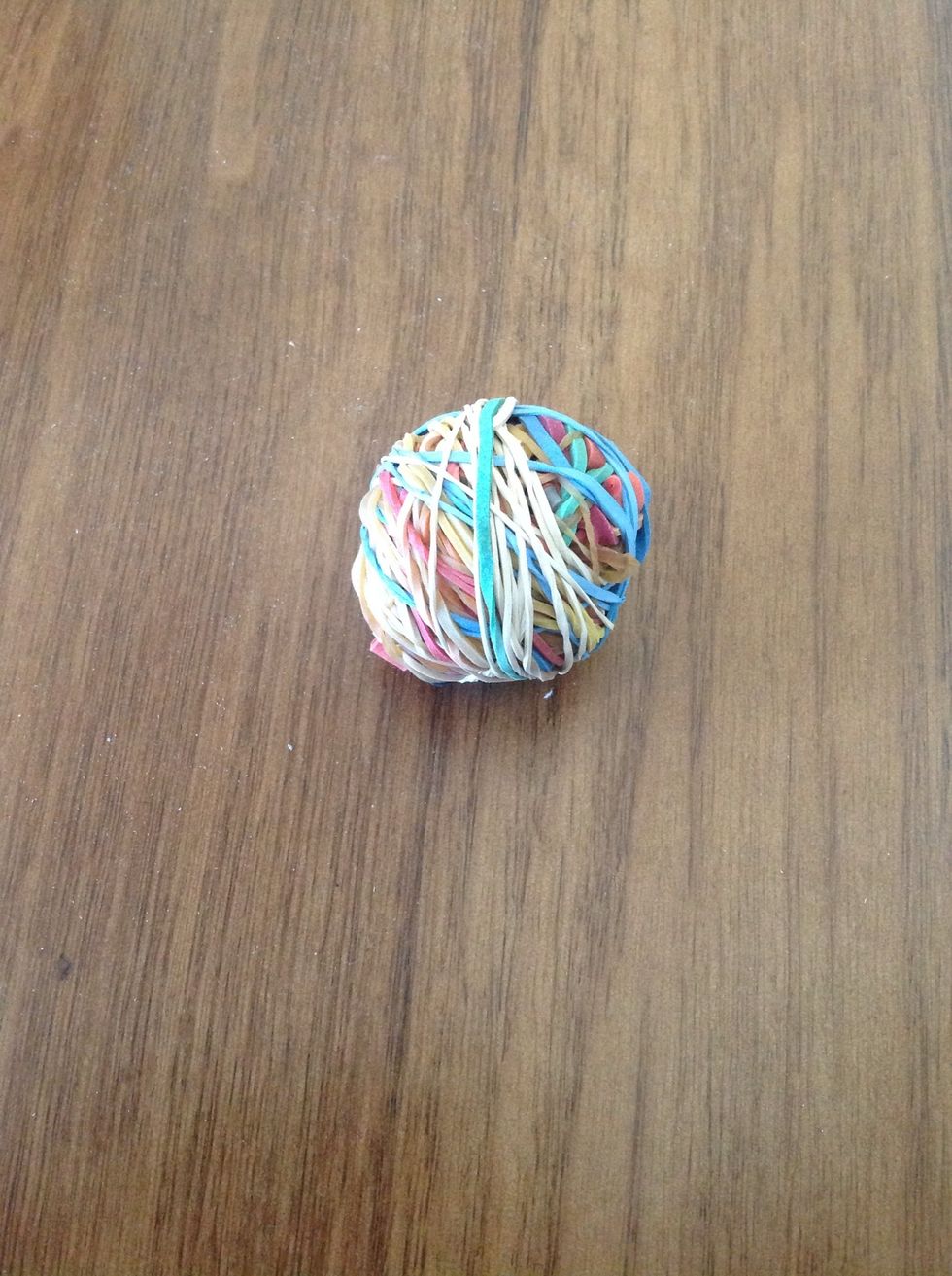 One it has formed a ball like shape begin wrapping rubber bands in all directions!