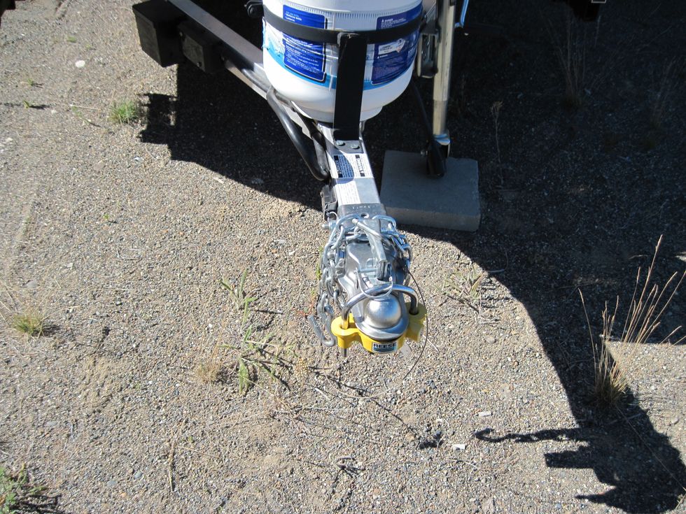 One light-weight travel trailer with hitch lock (the yellow thing).