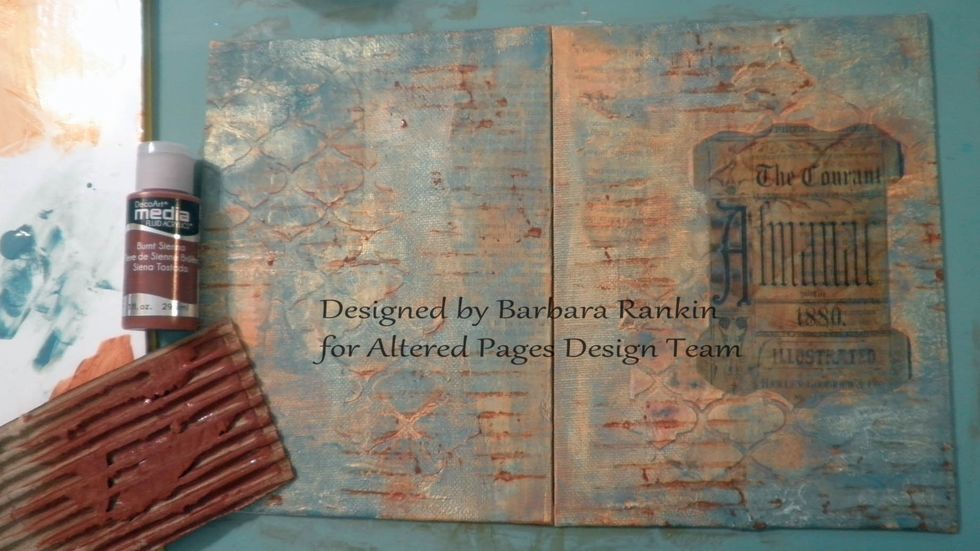 One of my favorite "mark making tools" is a piece of corrugated cardboard from packages. I painted DecoArt Burnt Sienna over the corrugations and randomly pressed the cardboard onto my cover.