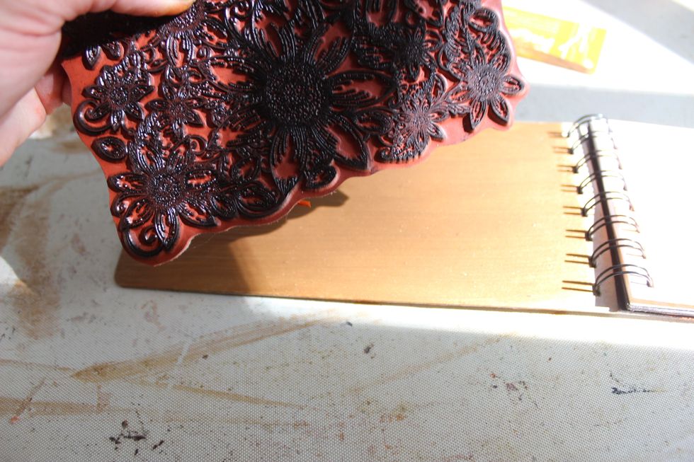 One of the middle pages of the mini is a chipboard page. I painted it with Velvet in Kona and them placed a different stamp on the wee paint to imprint a begins on it.