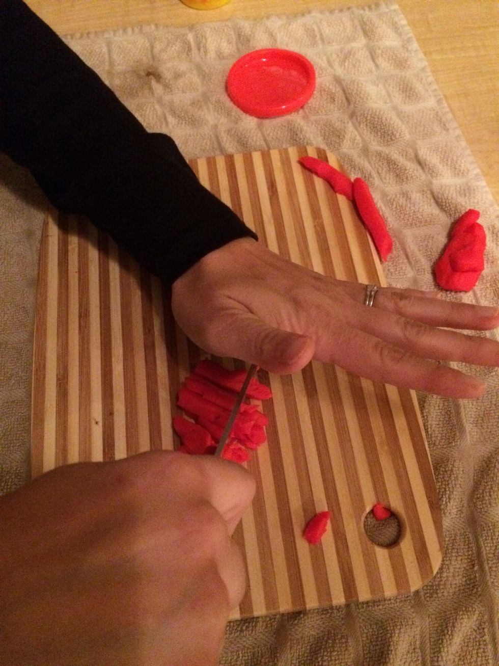 One option is to use a rocking motion to mince. One hand rests on the top of the knife at the top end to allow you to perform a rocking motion.