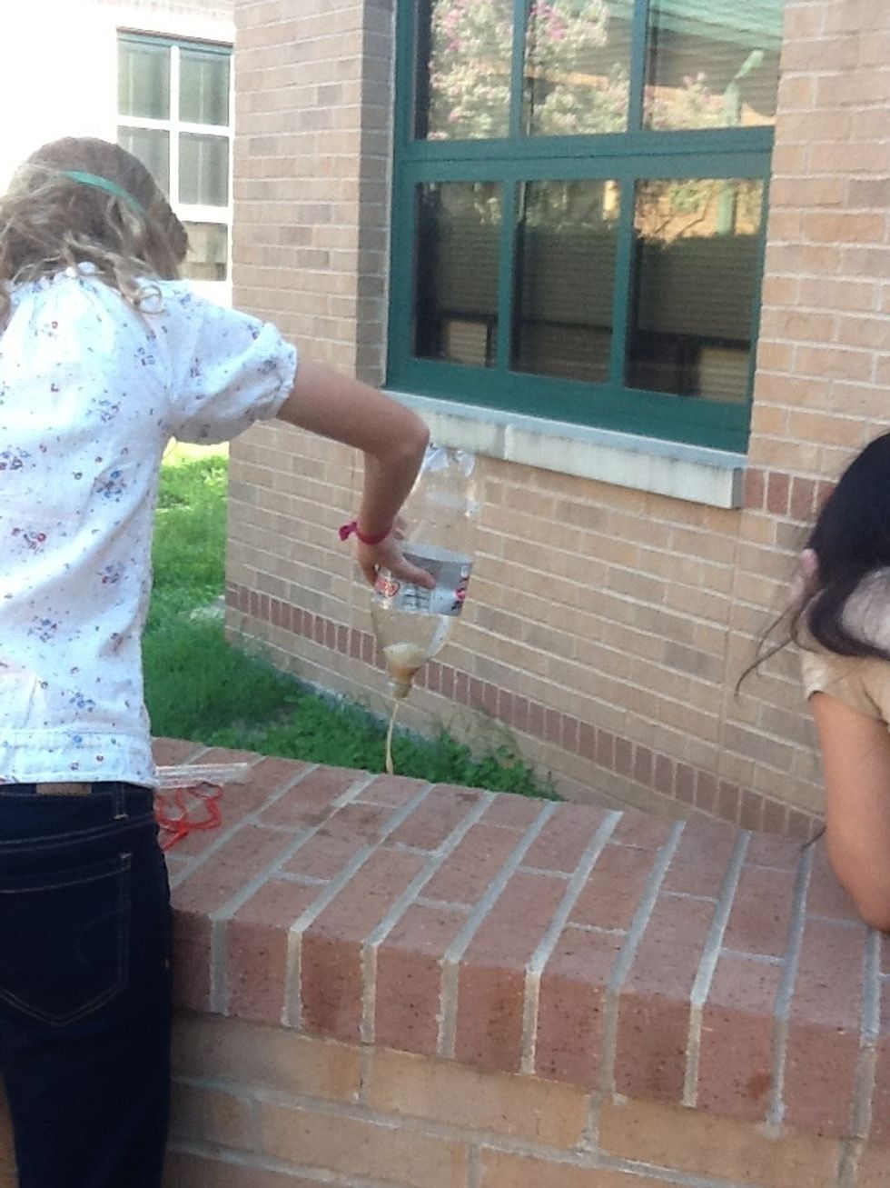 One person with safety goggles, take Diet Coke out of Zone of Death, screw red part until geyser comes off and set it aside. Pour anything in the bottle into the area your instructor specified