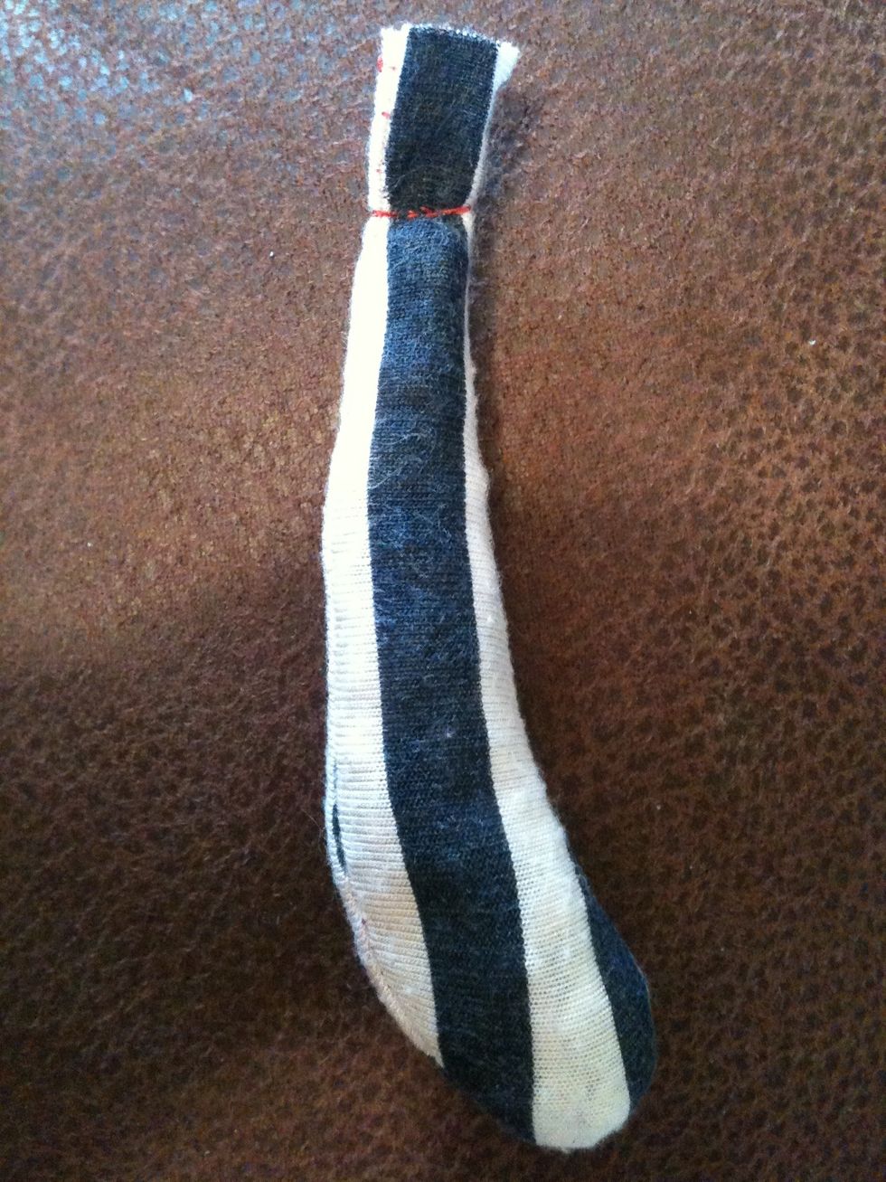 One stuffed tail! You attach the tail to the body the same way as the ears, make a hole and poke the end through then secure it. You can attach it where you want on the bears back, it doesn't matter.