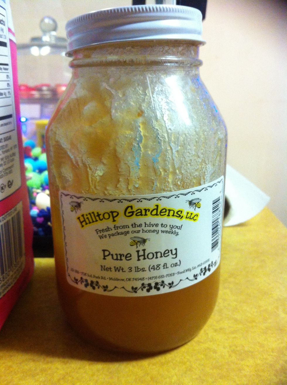 One tablespoon honey into a small mixing container