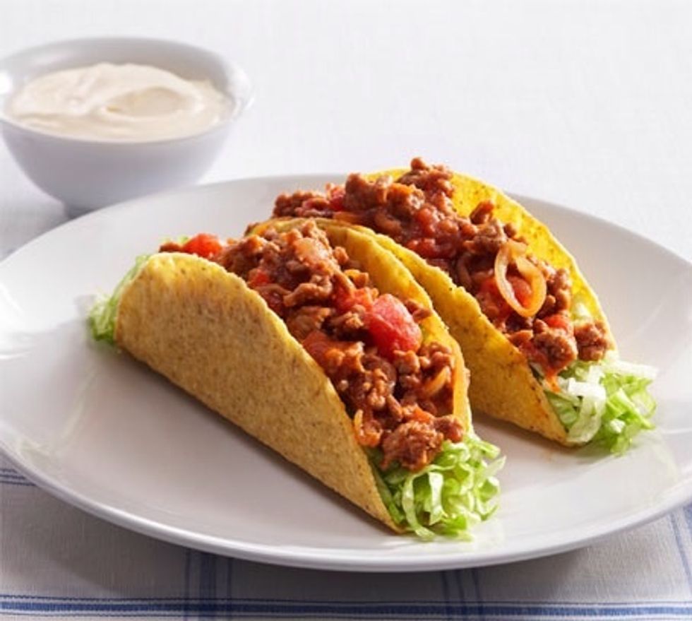 One taco with all the fillings will average 198 calories. 11.9 grams of fat equals to 53% of these calories, 14.6 grams of carbs equals to 28% and 9.3 grams of protein equals to 19% of these calories.