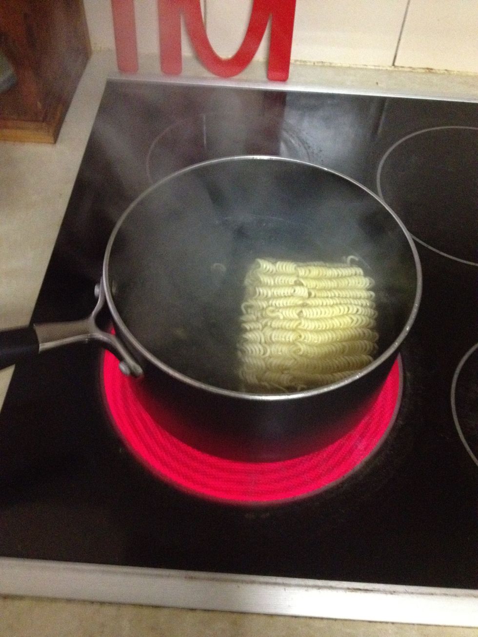 One the water boils add the noodles and lower the heat to low.