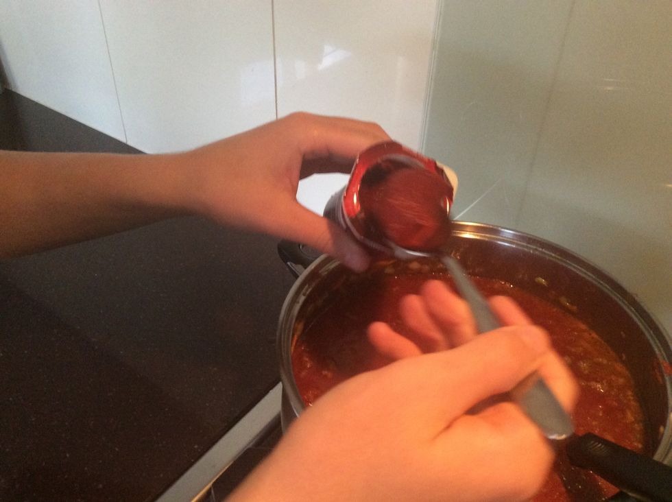 one to two minutes after, add tomato paste to the saucepan, and then continue to stir.