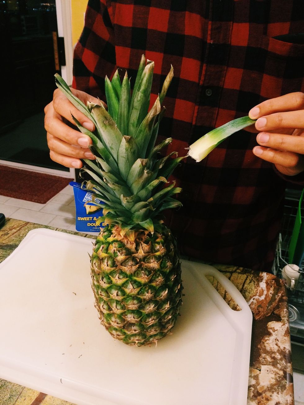 One way to tell if a pineapple is ripe is if it's easy to pull out a leaf