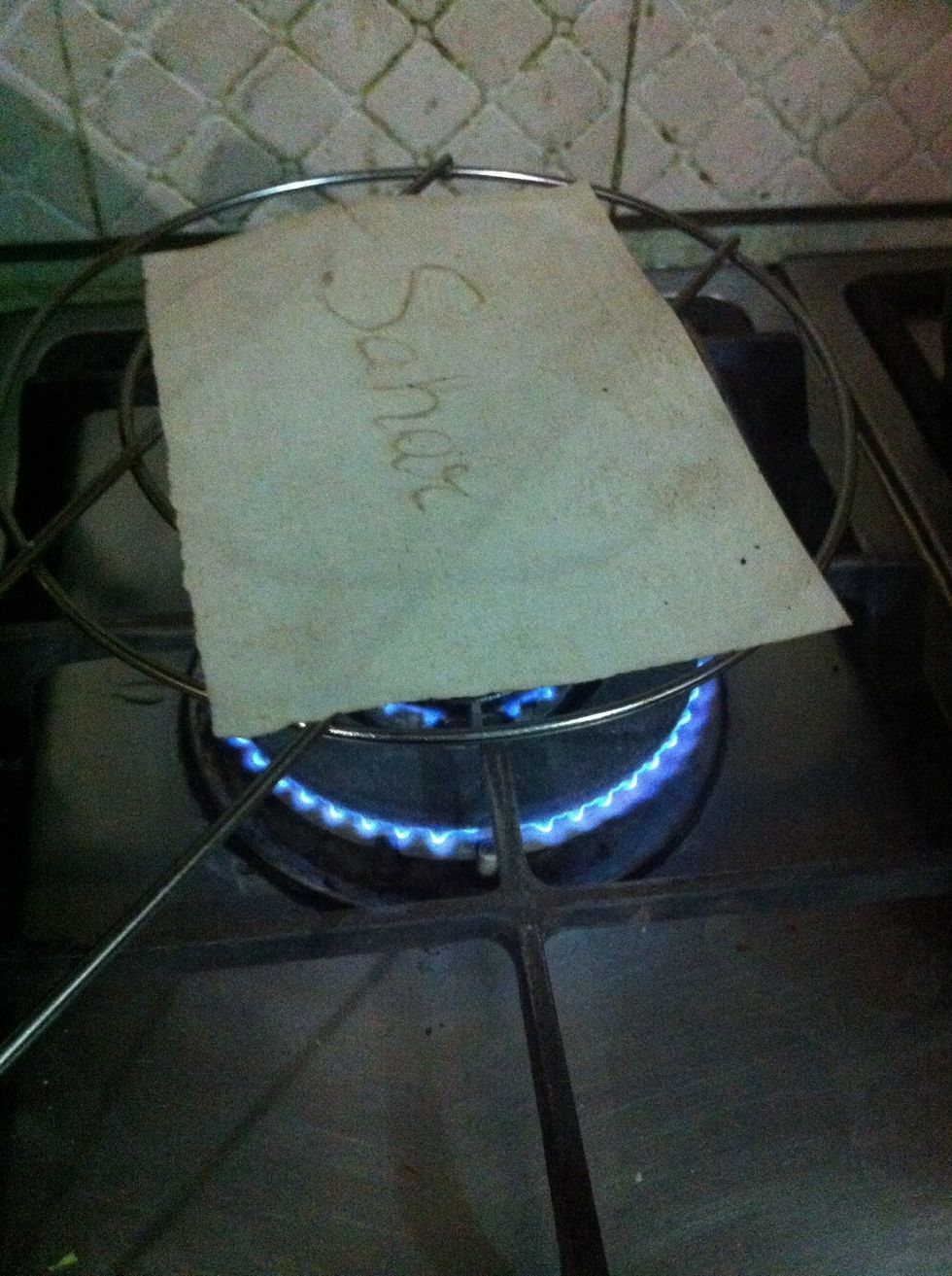 oops I'm burning my name lol.. don't burn your paper but instead slightly smoke it to dry and give little but smoky and crispy look...