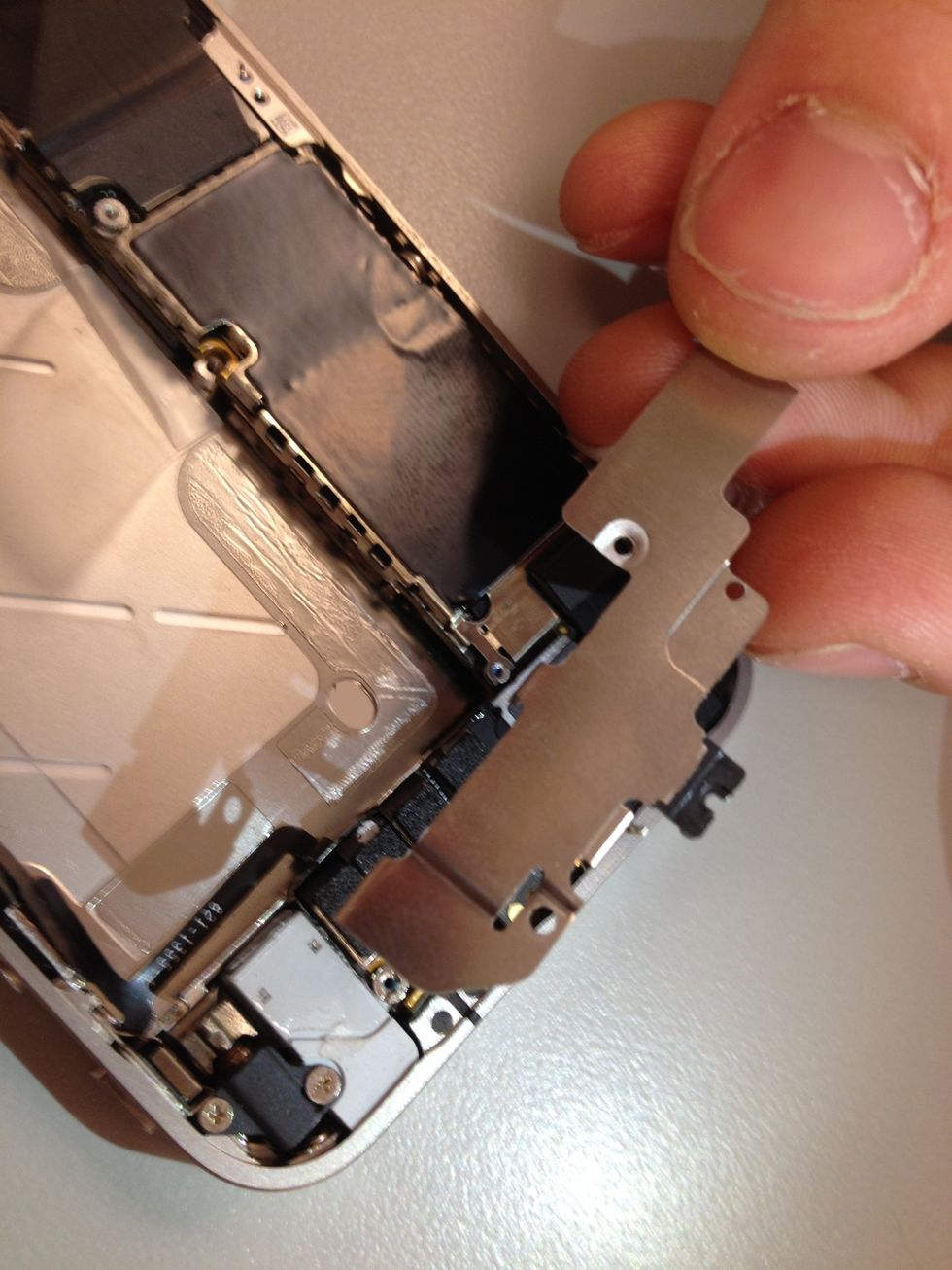 Oops, we got all those screws out and forgot to remove the plate earlier. That one is on us.