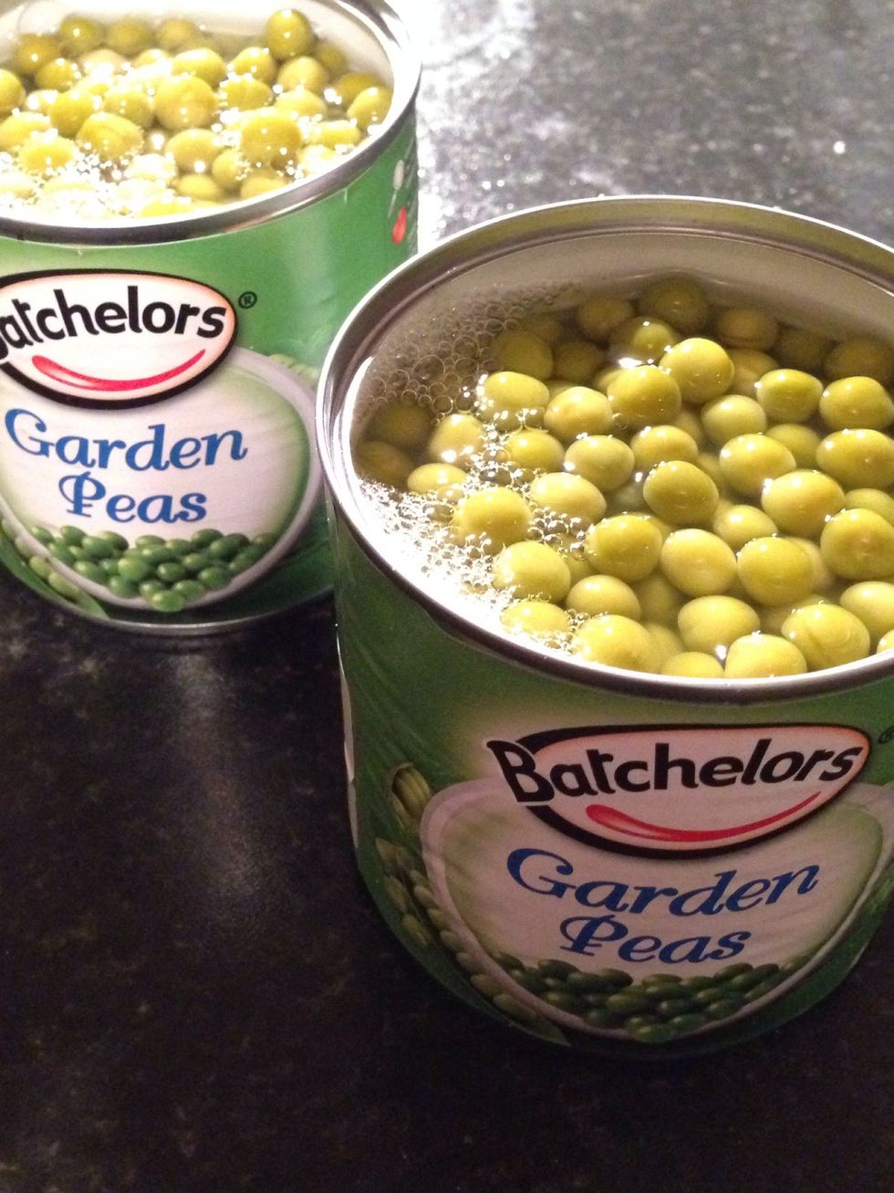 Open 2 tins of garden peas. Make sure you have GARDEN ones. If you'll use any others you'll get a messy pea soup.