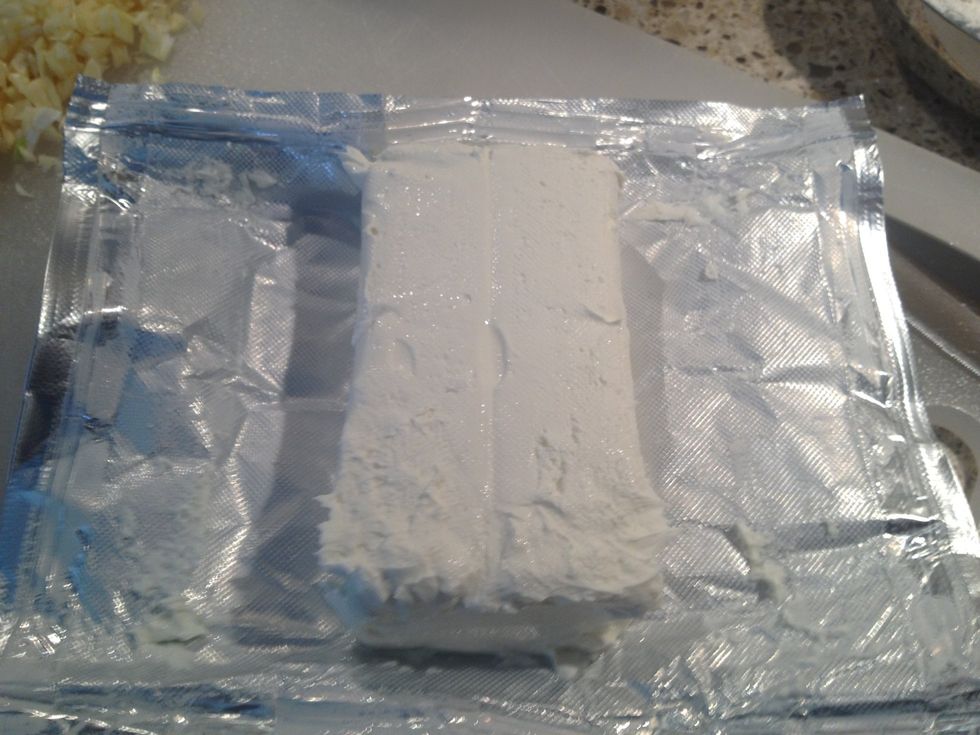 Open a block of cream cheese.